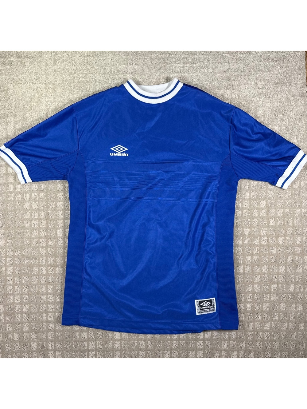 Umbro blue soccer jersey med